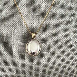 Retired James Avery Sterling and 14K Gold Oval Locket